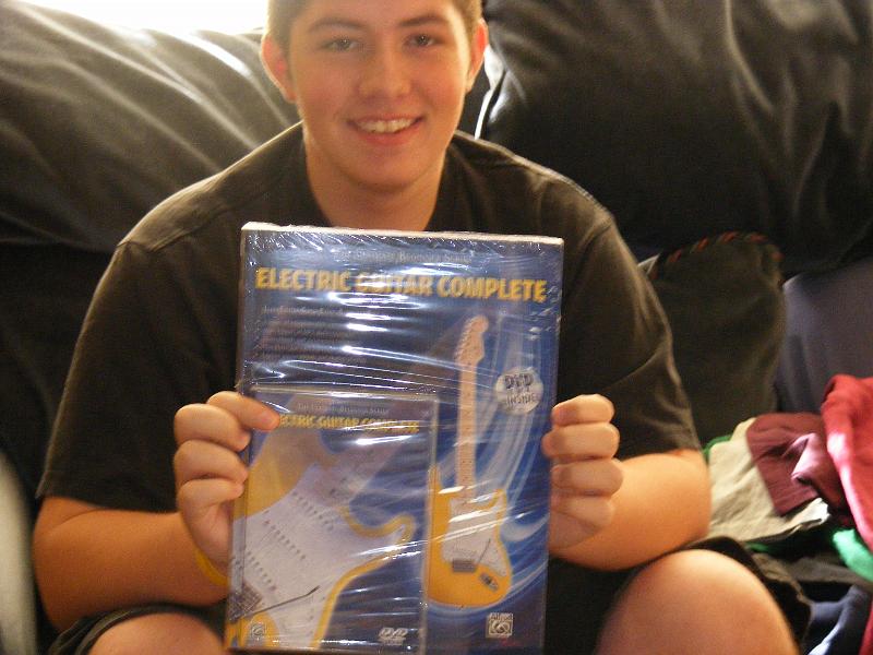 DSCF3938.JPG - Books and CDs to help him learn how to play his new guitar