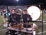 Playing the gong and the bass drum